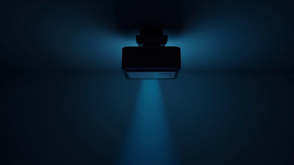 Close-up of projector lens mounted on ceiling, beam of light visible in dark room, technical detail shot